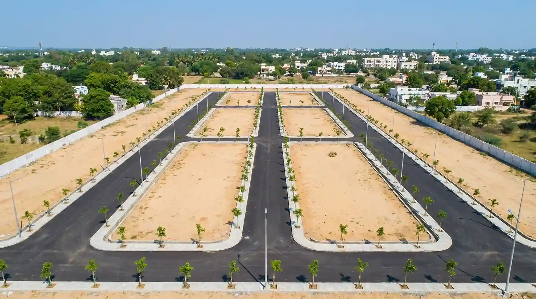 Residential plots for sale in Munagapaka city with wide roads and green landscaping